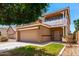 Charming two-story home featuring a spacious garage, second-story balcony, and well-maintained landscaping at 11724 N 148Th Ave, Surprise, AZ 85379