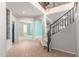 Open foyer featuring tile flooring, staircase, and arched doorways leading to other rooms at 11724 N 148Th Ave, Surprise, AZ 85379