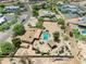 Spacious desert property features pool, cabana, circular driveway, mature trees, and fenced backyard at 12212 N 66Th St, Scottsdale, AZ 85254