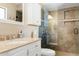 Bathroom features a vanity with granite countertop and a walk-in shower with tiled walls at 12212 N 66Th St, Scottsdale, AZ 85254