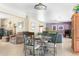Open-concept dining area with seating for four, seamlessly connecting to the living room and kitchen at 12212 N 66Th St, Scottsdale, AZ 85254