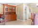 Dining room area with wood hutch and doorway to the laundry area at 12212 N 66Th St, Scottsdale, AZ 85254