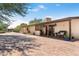 Charming single-story home with a welcoming front porch and desert-friendly landscaping, providing curb appeal at 12212 N 66Th St, Scottsdale, AZ 85254