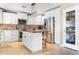 Eat-in kitchen featuring white cabinetry, stainless steel appliances, and butcher block island top at 12212 N 66Th St, Scottsdale, AZ 85254