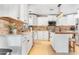 Kitchen with white cabinets, stainless appliances, brick backsplash, and a center island with butcher block at 12212 N 66Th St, Scottsdale, AZ 85254