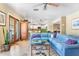 Open living space with light-blue leather sofa, glass coffee table, and easy access to the kitchen at 12212 N 66Th St, Scottsdale, AZ 85254