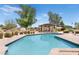 Beautiful backyard swimming pool with a covered lounge area, ideal for outdoor entertaining and relaxation at 12212 N 66Th St, Scottsdale, AZ 85254