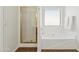 Bathroom with shower and tub with a window and shower head at 1239 W Descanso Canyon Dr, Casa Grande, AZ 85122