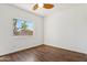 Bedroom with hardwood floors and a bright window at 1239 W Descanso Canyon Dr, Casa Grande, AZ 85122