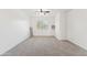 A carpeted bedroom features a ceiling fan and a window at 1239 W Descanso Canyon Dr, Casa Grande, AZ 85122