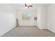 A bright bedroom includes a ceiling fan and a window at 1239 W Descanso Canyon Dr, Casa Grande, AZ 85122