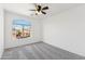 Carpeted bedroom features a ceiling fan and a window at 1239 W Descanso Canyon Dr, Casa Grande, AZ 85122