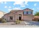 Charming two-story home with manicured front yard and attached two car garage at 1239 W Descanso Canyon Dr, Casa Grande, AZ 85122