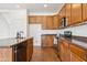 Well-organized kitchen featuring wooden cabinets, stainless steel appliances, and a spacious countertops at 1239 W Descanso Canyon Dr, Casa Grande, AZ 85122