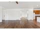 Open living room features hardwood floors and white walls providing a spacious atmosphere at 1239 W Descanso Canyon Dr, Casa Grande, AZ 85122