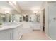 The spacious bathroom with tub, shower and double sinks is well lit at 13041 S 45Th Pl, Phoenix, AZ 85044