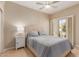 Bedroom with neutral tones, shuttered window and nice bedding at 13041 S 45Th Pl, Phoenix, AZ 85044