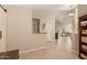 Bright foyer with neutral walls, tiled flooring, direct access to a bedroom, and views into the living room at 13041 S 45Th Pl, Phoenix, AZ 85044