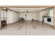 Spacious garage with built in cabinets, epoxy floor, and laundry appliances at 13041 S 45Th Pl, Phoenix, AZ 85044