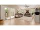 Bright living room with access to the outdoors and views of lush greenery at 13041 S 45Th Pl, Phoenix, AZ 85044