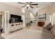 Open-concept living area with neutral tones, large TV, and a seamless flow at 13041 S 45Th Pl, Phoenix, AZ 85044