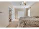 Bedroom featuring neutral walls, carpet flooring, and closet with mirrored sliding doors at 13824 W Gelding Dr, Surprise, AZ 85379
