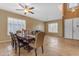 Spacious dining area featuring a large window with shutters, providing natural light and privacy at 13824 W Gelding Dr, Surprise, AZ 85379