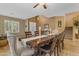 Elegant dining room with a large wooden table and seating for eight; a space designed for memorable gatherings at 13824 W Gelding Dr, Surprise, AZ 85379