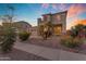 Attractive home featuring a balcony, desert landscaping, a three-car garage and well-kept surroundings at 13824 W Gelding Dr, Surprise, AZ 85379