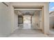 Spacious three-car garage providing ample parking and storage with access to the backyard at 13824 W Gelding Dr, Surprise, AZ 85379