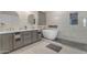 Stunning bathroom with a modern soaking tub, dual sinks, and a frameless glass shower at 13824 W Gelding Dr, Surprise, AZ 85379