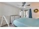 Comfortable bedroom leading to a patio, showcasing natural light and a peaceful atmosphere at 14300 W Bell Rd # 312, Surprise, AZ 85374