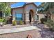 Charming home features a desert landscaped yard, arched entryway and covered front porch at 14300 W Bell Rd # 312, Surprise, AZ 85374