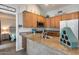 Stylish kitchen with granite countertops, wooden cabinets and modern appliances at 14300 W Bell Rd # 312, Surprise, AZ 85374