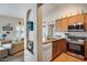 Charming kitchen with granite counters, stainless appliances, and open view to the living room at 14300 W Bell Rd # 312, Surprise, AZ 85374