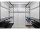Walk-in closet with metal shelving, providing ample space for organization at 14300 W Bell Rd # 312, Surprise, AZ 85374