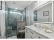 Bathroom featuring glass shower, stylish vanity and tiled walls at 14517 W Cortez St, Surprise, AZ 85379