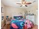 A delightful bedroom with ceiling fan, hard floors and a vibrant energy at 14517 W Cortez St, Surprise, AZ 85379