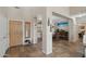 Inviting foyer with tile flooring, natural light, and a view of the dining area, perfect for welcoming guests at 14517 W Cortez St, Surprise, AZ 85379