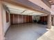Spacious three-car garage with epoxy flooring and custom built-in storage cabinets at 14517 W Cortez St, Surprise, AZ 85379