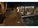 Cozy outdoor patio with a fire pit, grill, and comfortable seating near the pool at 14517 W Cortez St, Surprise, AZ 85379