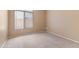 Bedroom with neutral paint, carpet, and window, offering ample space at 15032 N 54Th Pl, Scottsdale, AZ 85254