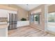 Breakfast nook with stainless steel fridge and view of the backyard at 15032 N 54Th Pl, Scottsdale, AZ 85254