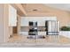 Kitchen with granite countertops, stainless steel appliances, and sleek white cabinets at 15032 N 54Th Pl, Scottsdale, AZ 85254