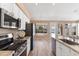 Kitchen featuring stainless steel appliances, granite counters, and a view of the backyard at 15032 N 54Th Pl, Scottsdale, AZ 85254