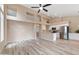 Bright living room with vaulted ceilings, wall insets, light wood floors, and stainless steel appliances at 15032 N 54Th Pl, Scottsdale, AZ 85254