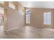 Spacious living room with wood-look flooring, high ceilings, and bright windows at 15032 N 54Th Pl, Scottsdale, AZ 85254