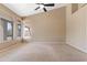 Spacious main bedroom with vaulted ceiling, carpet, and plenty of light from the wall of windows at 15032 N 54Th Pl, Scottsdale, AZ 85254