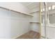 Large walk-in closet with carpet flooring and shelving for plenty of storage at 15032 N 54Th Pl, Scottsdale, AZ 85254