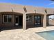 Backyard boasts a large pool with multiple access doors to the home at 15625 N Jerry St, Surprise, AZ 85378